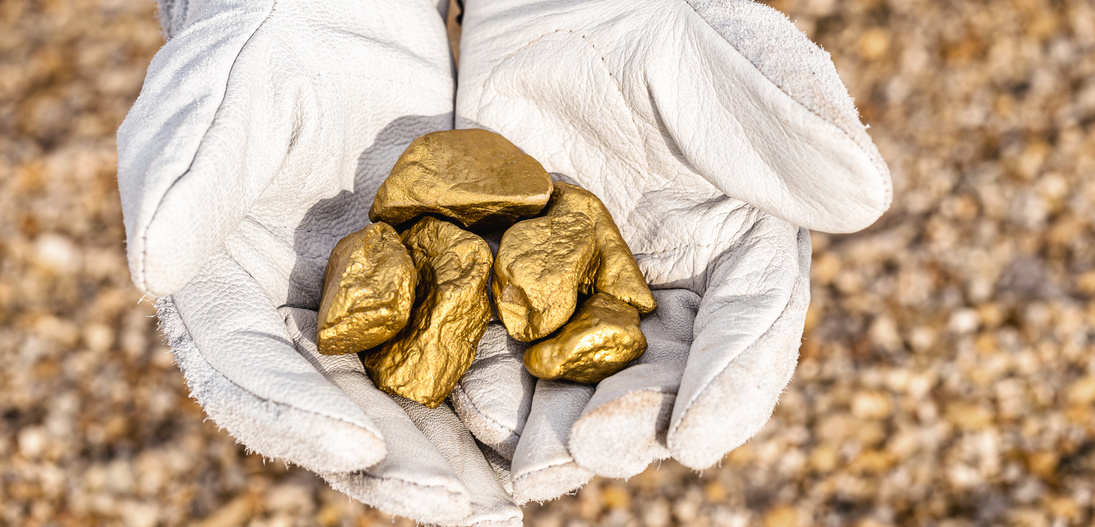 miner hand holding stones from another, gold mineral extraction, precious stone exploration concept.